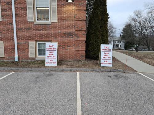 Use the two rear spots at Town Hall for curbside service